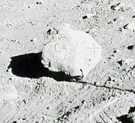 The letter 'C' visible on a lunar rock